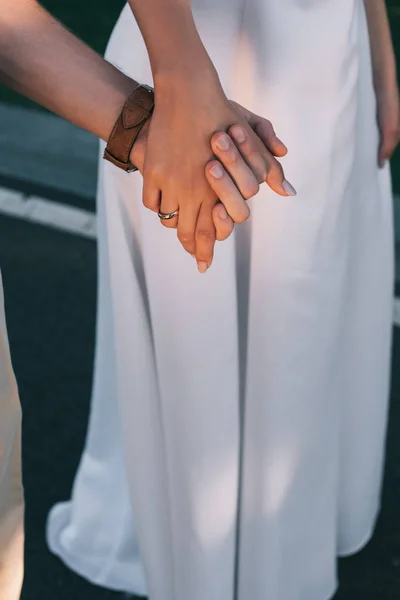 Close Partial View Romantic Young Wedding Couple Holding Hands Outdoors — Stock Photo, Image