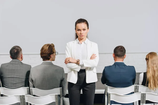 Serious Coach Crossed Arms Looking Camera Business Training Hub — Free Stock Photo