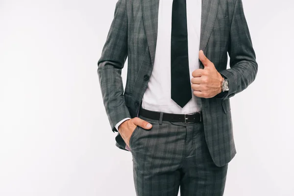 Imagem Cortada Empresário Segurando Jaqueta Com Mão Bolso Isolado Branco — Fotografia de Stock