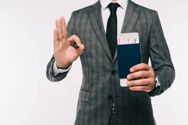 Imagem Cortada Empresário Segurando Passaporte Bilhete Mostrando Gesto Isolado Branco — Fotografia de Stock