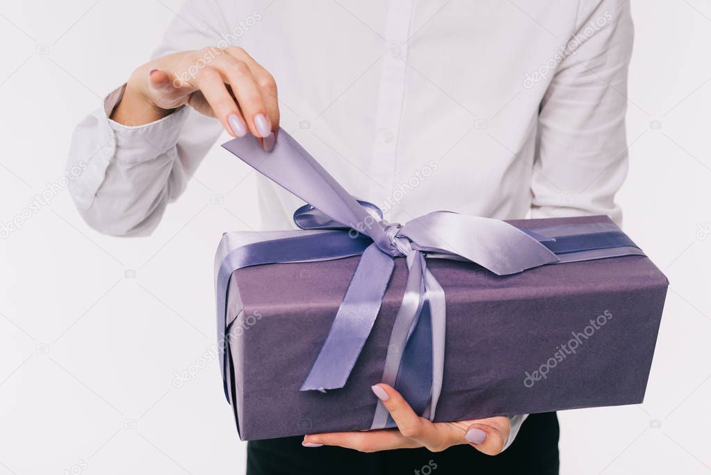 cropped image of businesswoman opening present box isolated on white