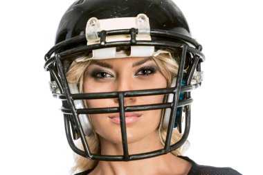 close-up shot of serious young woman in american football helmet looking at camera isolated on white clipart