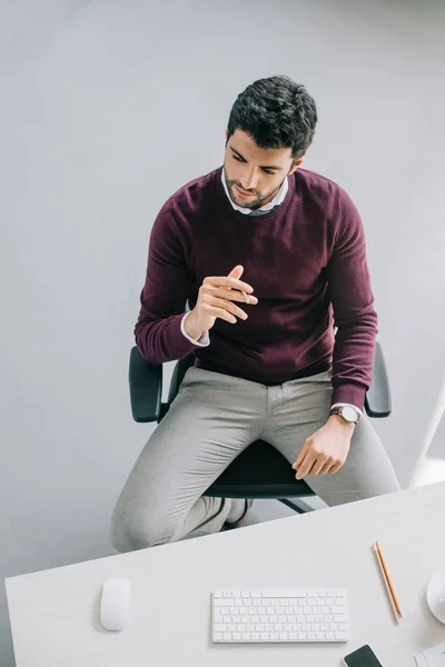 High Angle View Pensive Handsome Designer Burgundy Sweater Sitting Table — Free Stock Photo