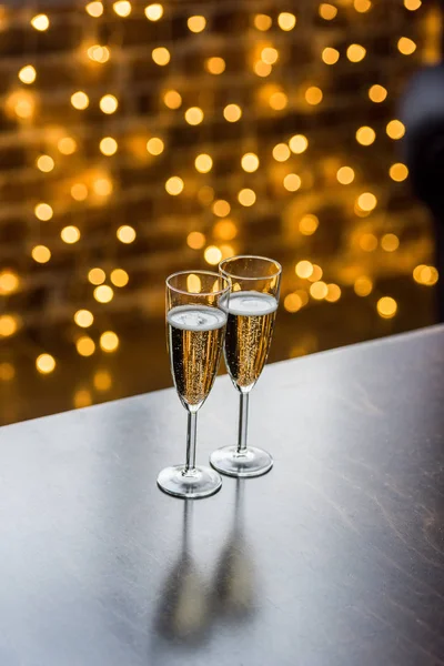 Close View Two Glasses Champagne Golden Bokeh Background — Stock Photo, Image