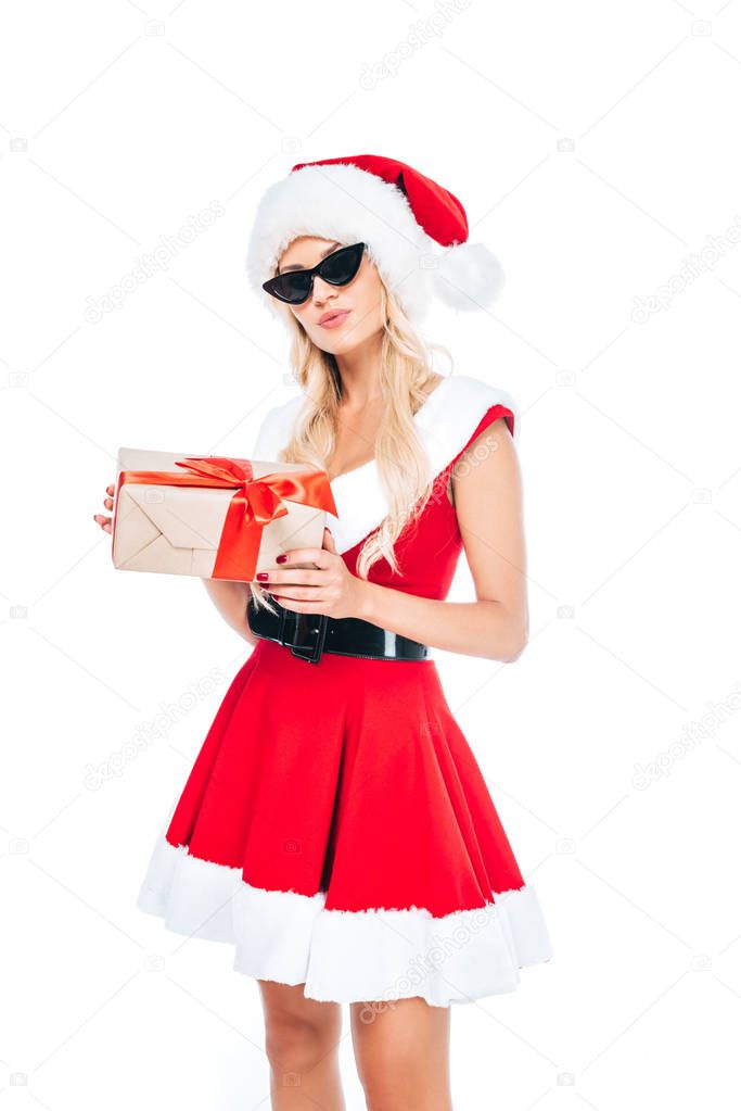 young santa girl in sunglasses holding gift box isolated on white background 