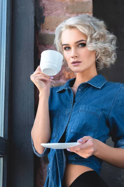Attractive Young Woman Denim Shirt Drinking Coffee Looking Camera — Stock Photo, Image