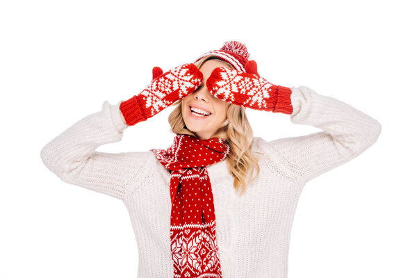 beautiful smiling young woman in red mittens closing eyes isolated on white