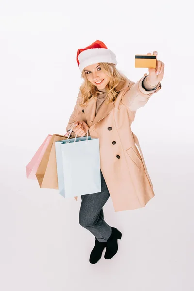 Visão Alto Ângulo Feliz Jovem Santa Chapéu Segurando Sacos Compras — Fotografia de Stock Grátis