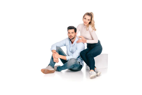 Beautiful Young Couple Sitting Together Smiling Camera Isolated White — Stock Photo, Image