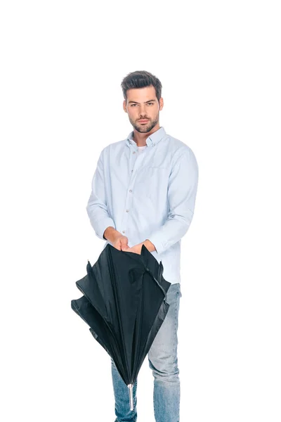 Handsome Young Man Holding Black Umbrella Looking Camera Isolated White — Free Stock Photo