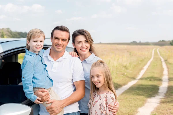 Happy Young Family Car Looking Camera Field — Stock Photo, Image