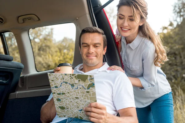 Happy Adult Couple Looking Map While Travelling Car — Stock Photo, Image