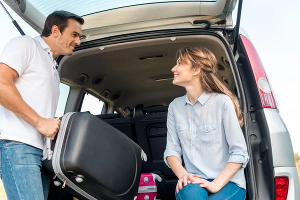 Happy Adult Man Packing Luggage Car Trunk While His Girlfriend — Stock Photo, Image