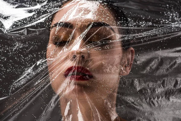 View Wet Cellophane Beautiful Young Woman Closed Eyes Black — Stock Photo, Image