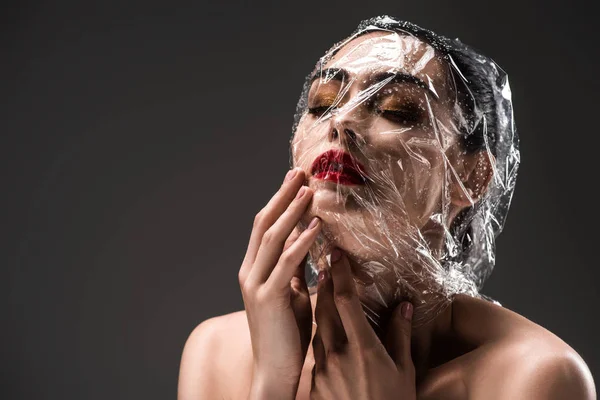 Sensual Woman Face Wrapped Transparent Cellophane Drops Isolated Black — Stock Photo, Image