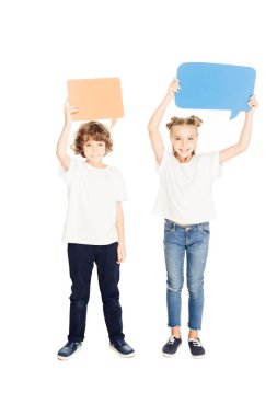 cheerful adorable children holding paper speech bubbles above heads isolated on white clipart