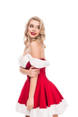Genç seksi elbiseli kadın uzak üzerinde beyaz izole Noel ile çıplak omuz arıyorum