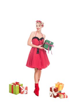 beautiful young pin up woman standing near pile of gift boxes isolated on white clipart