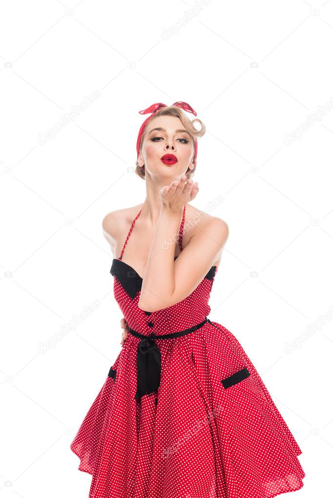 pretty young pin up woman blowing air kiss isolated on white 