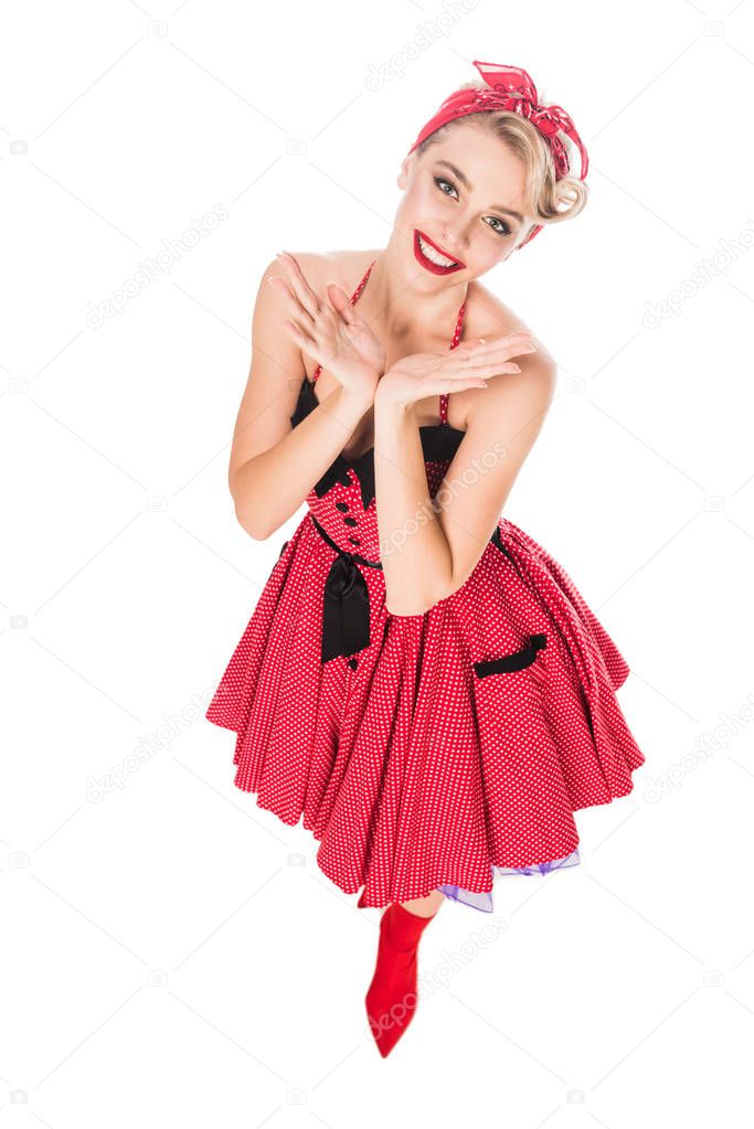 high angle view of cheerful woman in pin up dress isolated on white