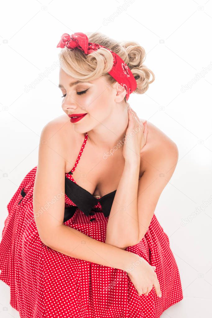 high angle view of stylish yougn pin up woman with red lips posing isolated on white