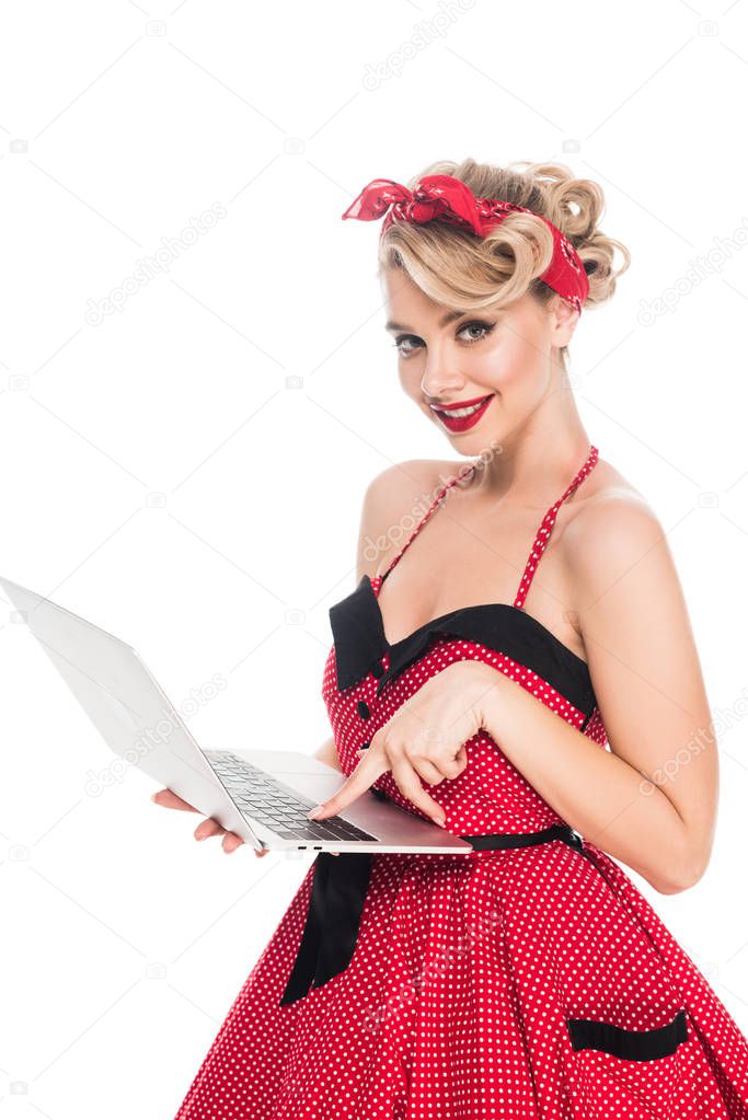 portrait of smiling woman in pin up style clothing with laptop isolated on white