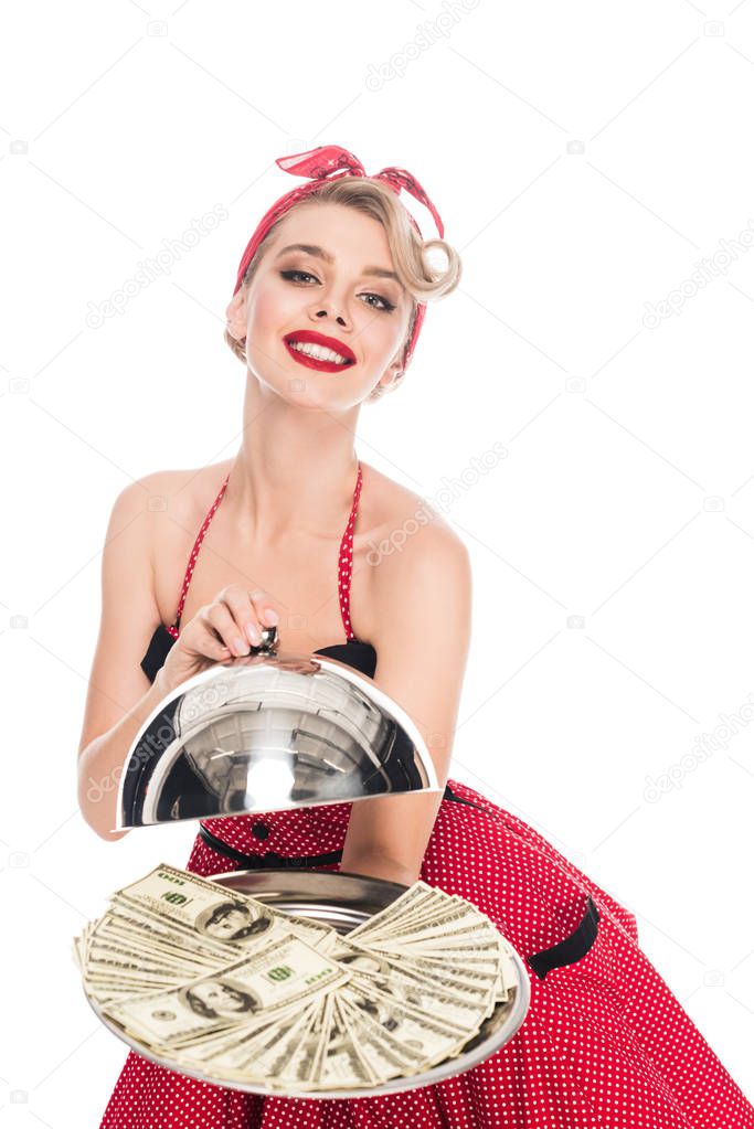 portrait of beautiful pin up woman with dollar banknotes on serving tray isolated on white