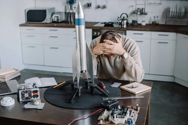 Exhausted Engineer Sitting Table Rocket Model Home — Stock Photo, Image