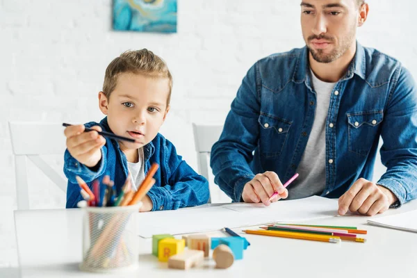 Handsome Young Father Drawing Adorable Little Son Home — Stock Photo, Image