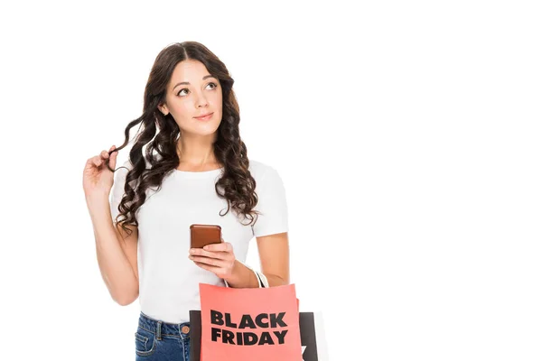 Thoughtful Woman Using Smartphone Holding Shopping Bags Black Friday Sign — Stock Photo, Image