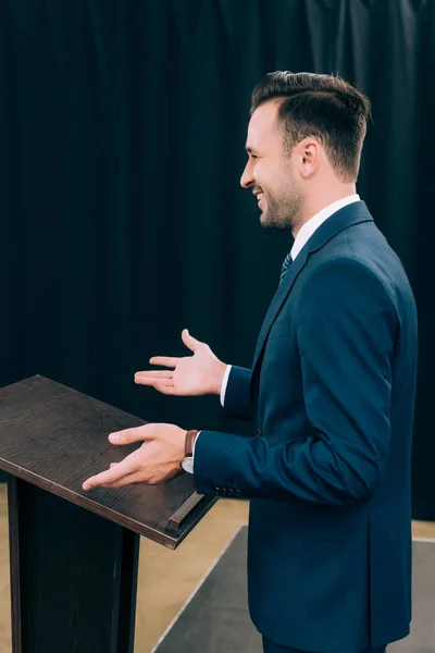 Side View Handsome Lecturer Standing Gesturing Podium Tribune Seminar Conference — Stock Photo, Image