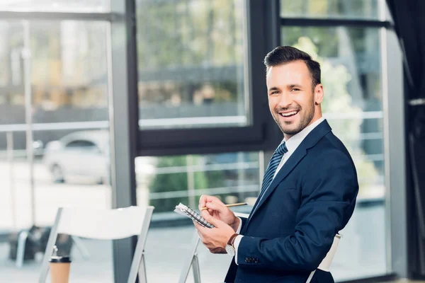 Side View Cheerful Businessman Notebook Conference Hall — Stock Photo, Image