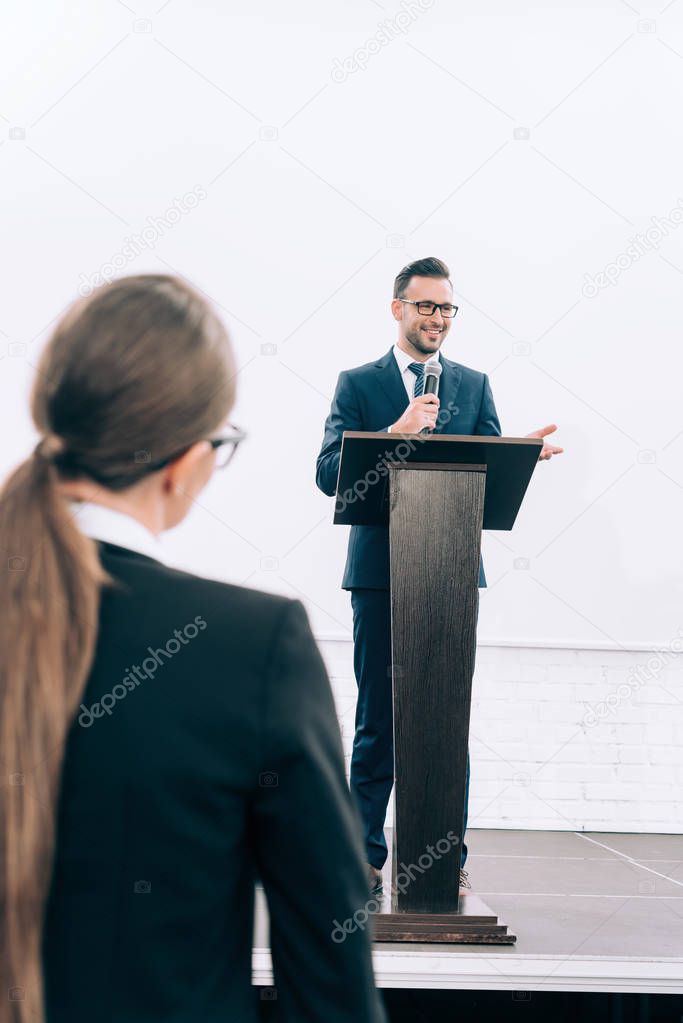 handsome speaker talking during seminar in conference hall
