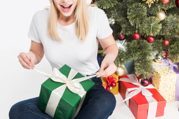 Partial View Emotional Woman Wrapped Gift Sitting Christmas Tree Isolated — Free Stock Photo