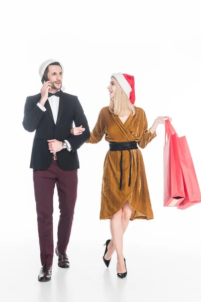 Attractive Man Talking Smartphone Girlfriend Santa Claus Hat Shopping Bags — Stock Photo, Image