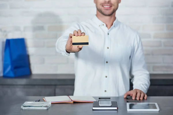 Cropped Shot Smiling Young Salesman Holding Credit Card Shop — Stock Photo, Image