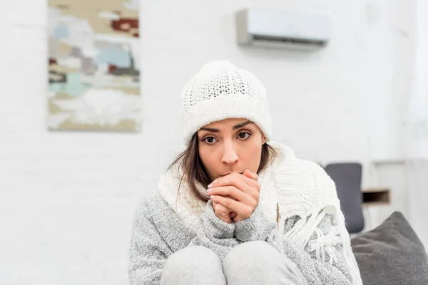 Freezed Young Woman Warm Clothes Sitting Couch Home Blowing Hands — Stock Photo, Image