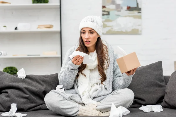 Sick Young Woman Warm Clothes Sitting Messy Couch Sneezing Paper — Stock Photo, Image