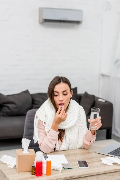 Sick Young Businesswoman Scarf Taking Pill Workplace — Free Stock Photo