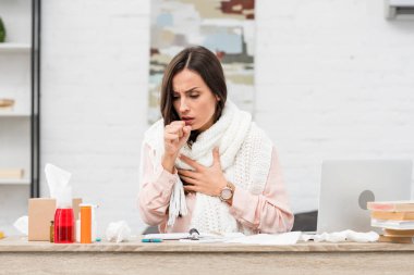 sick young businesswoman having cough at workplace clipart