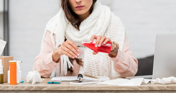 cropped shot of sick young woman at home