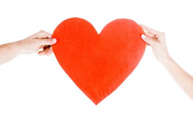 Partial view of people holding big red heart isolated on white