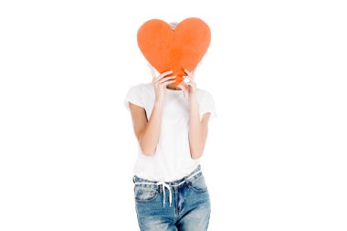 Woman in white t-shirt holding red big heart shape in front of face isolated on white clipart
