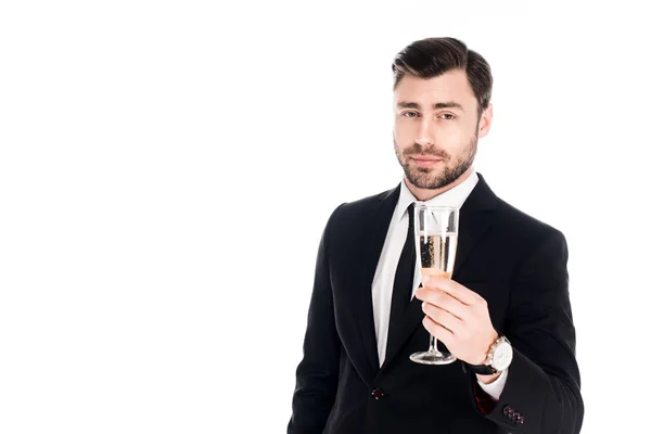 Pohledný Muž Černém Kostýmu Sklenkou Šampaňského Izolované Bílém — Stock fotografie