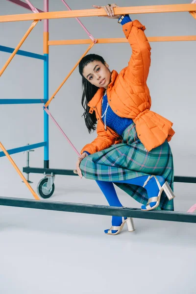 Fashionable African American Female Model Orange Winter Jacket Checkered Skirt — Stock Photo, Image