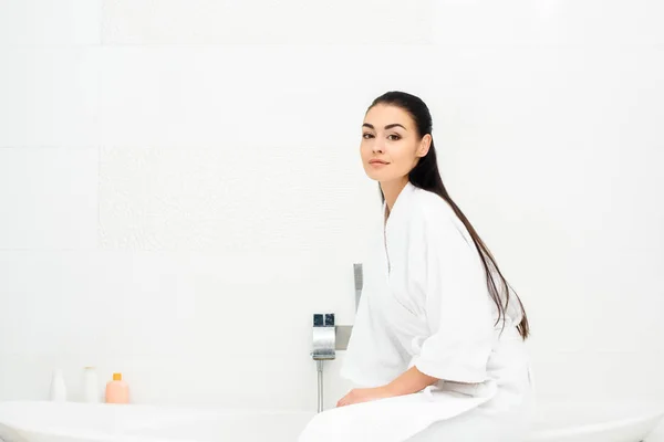 Attractive Woman Bathrobe Sitting White Bathroom — Stock Photo, Image