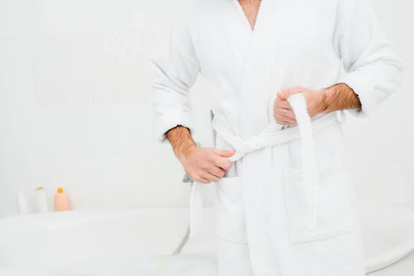 Cropped View Male Hands Untying Bathrobe White Bathroom — Free Stock Photo