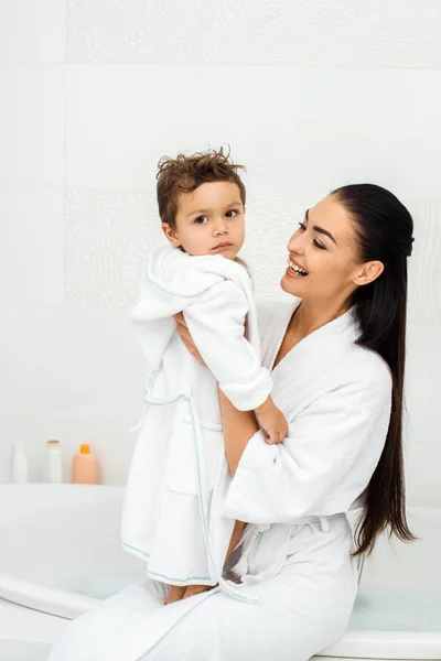 Mother Laughing Looking Toddler Son White Bathrobe — Stock Photo, Image