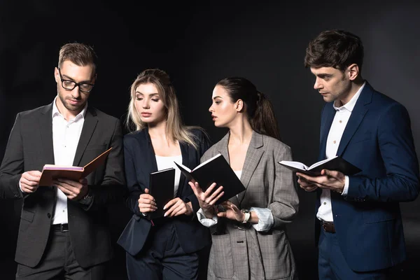 Group Successful Business People Reading Notebooks Together Isolated Black — Stock Photo, Image
