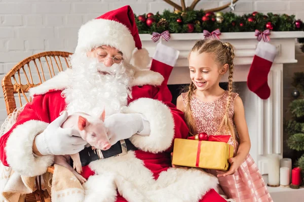 Santa Claus Playing Pig Cute Smiling Kid Holding Gift Box — Stock Photo, Image